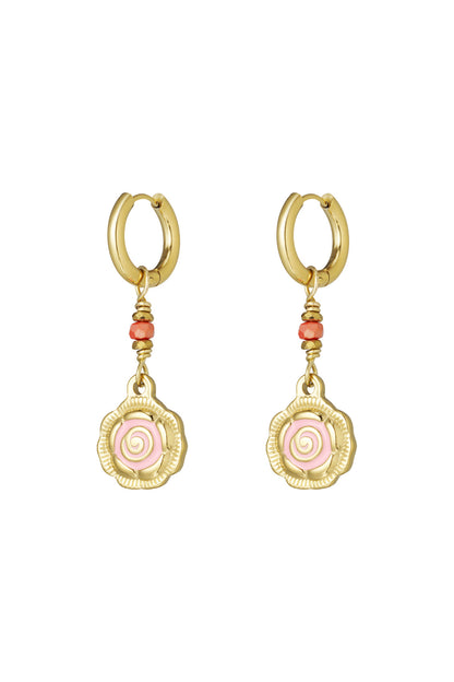 Pair of gold-tone hoop earrings with dangling spiral flower charms in pink and coral beads on white background