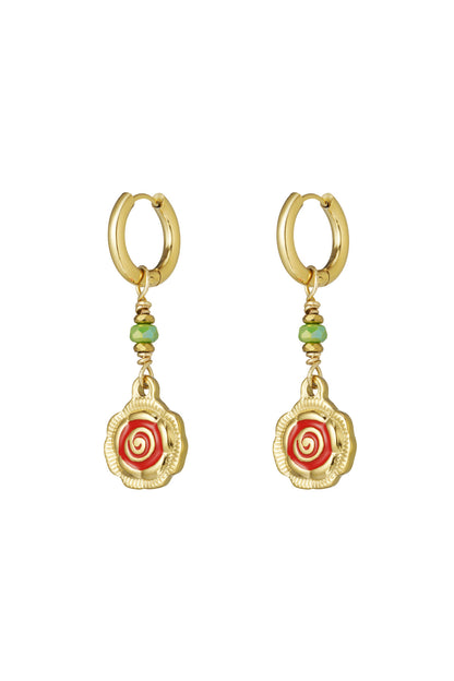 Pair of gold-tone hoop earrings with dangling spiral flower charms in red and green beads on white background