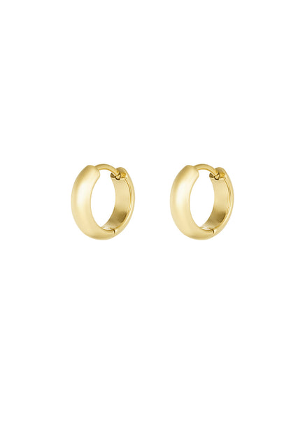 Pair of polished gold mini hoop earrings on white background