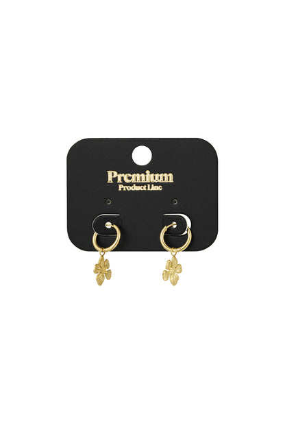 Gold floral charm hoop earrings displayed on a black premium product line card