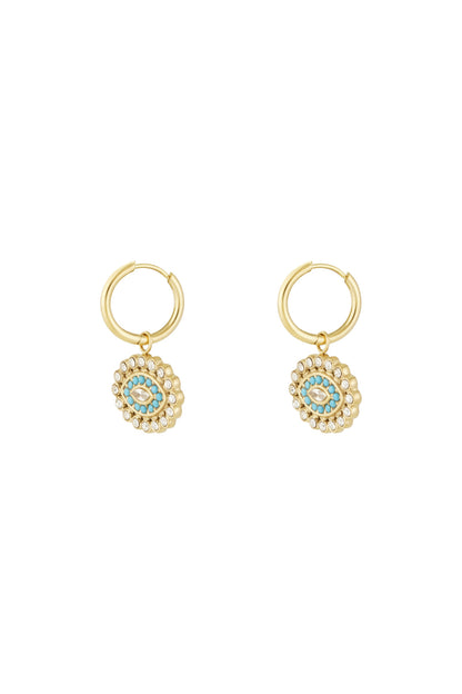 Gold stainless steel hoop earrings with turquoise and rhinestone evil eye charms on white background