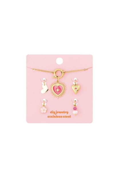 Sculpted Gold Charm Set III: A gold chain with a pink heart pendant and four assorted dainty heart, floral, and bead charms.