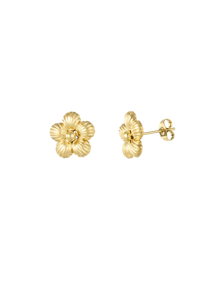 Gold fluted flower stud earrings shown on white background