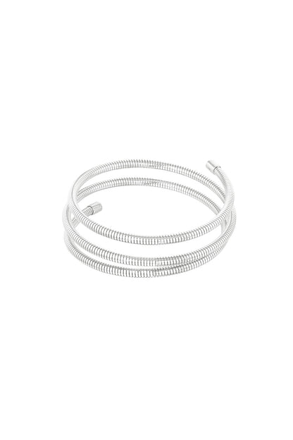 Silver spiral coil cuff bracelet with three flexible loops isolated on white background
