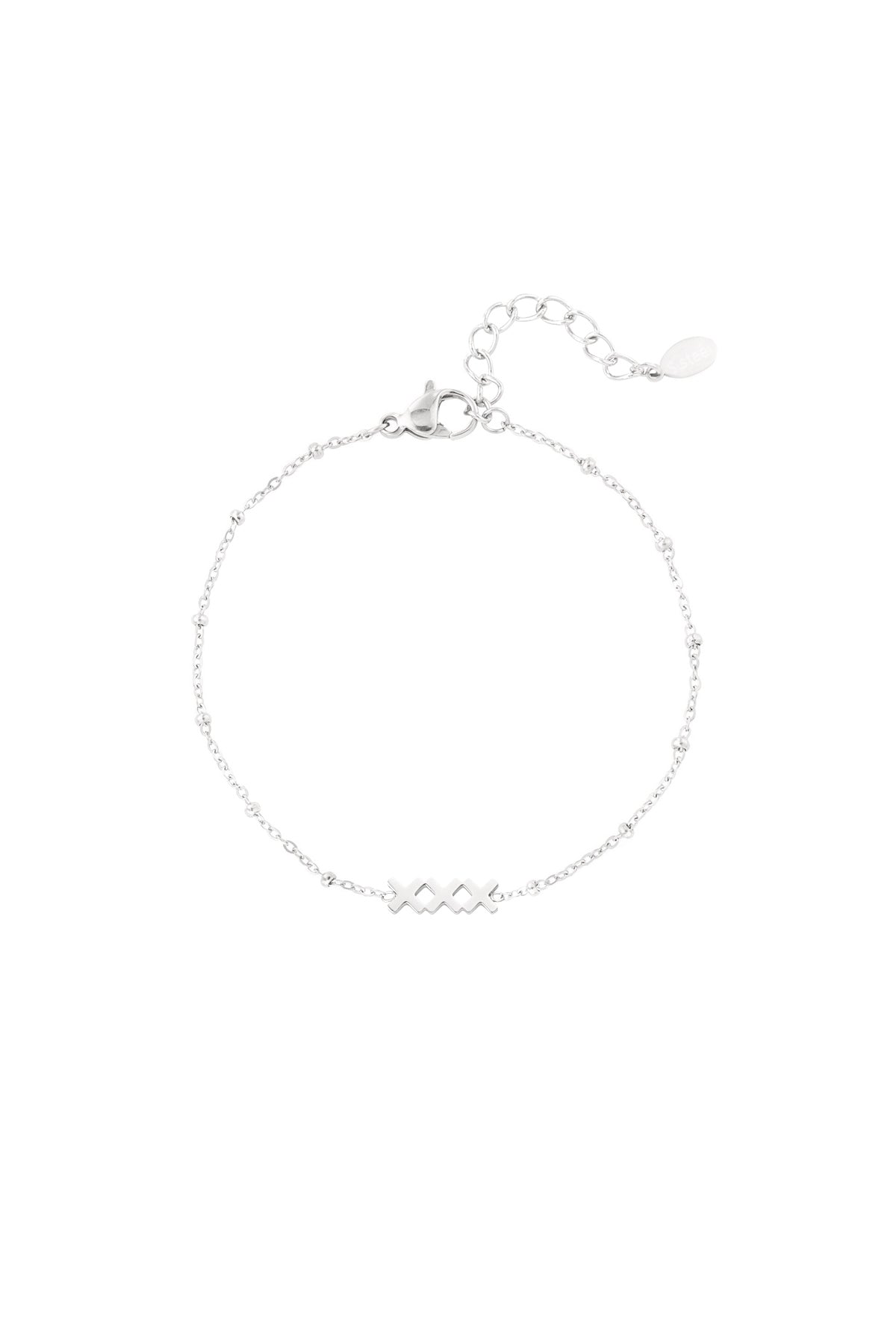Close-up of a silver version of the minimalist 'XXX' charm bracelet on white background