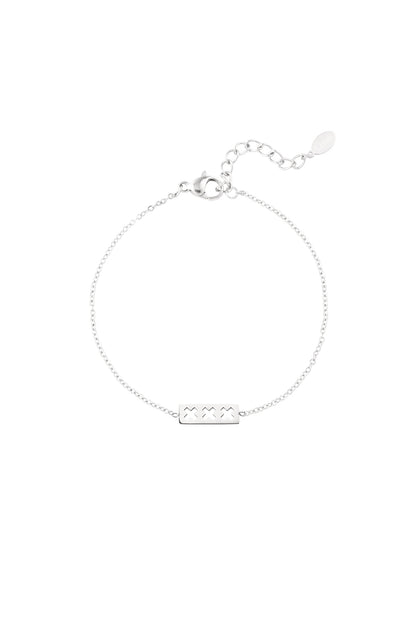 Silver triple X minimalist bracelet with adjustable chain and lobster clasp shown on white background