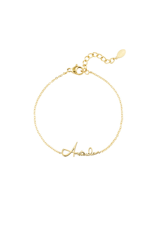 Gold Amsterdam Script Bracelet with delicate chain and adjustable clasp on white background
