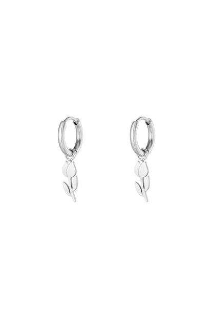 Pair of silver minimalist tulip drop hoop earrings on white background