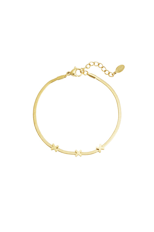 Gold triple X charm bracelet with smooth chain and lobster clasp on white background