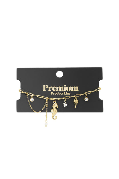Silver ocean charm bracelet with seahorse, palm tree, pearl, and crystal charms on link chain