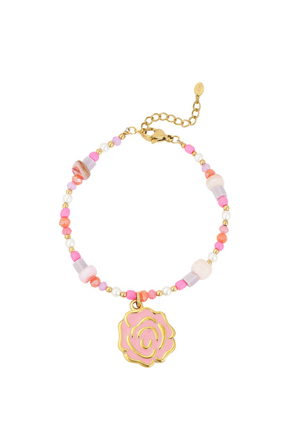 Beaded bracelet with pink rose charm and gold lobster clasp on white background