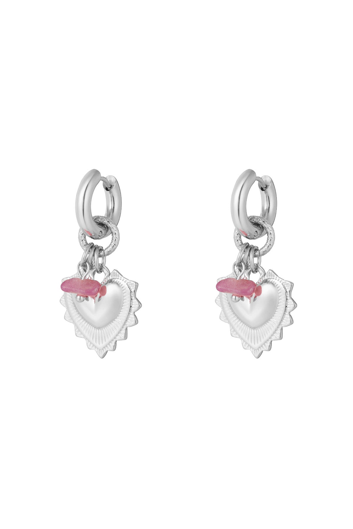 Pair of silver drop earrings with heart-shaped charms and pink stone beads on white background