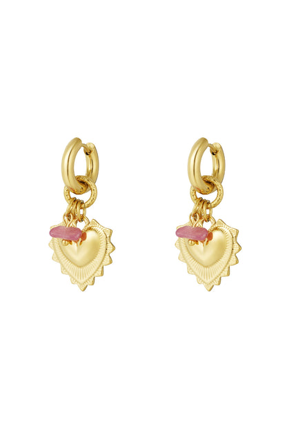 Pair of gold drop earrings featuring heart-shaped charms and small pink stone beads