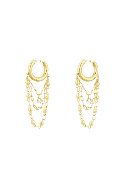 Gold chained hoop drop earrings with three delicate chains and rhinestone charm on white background