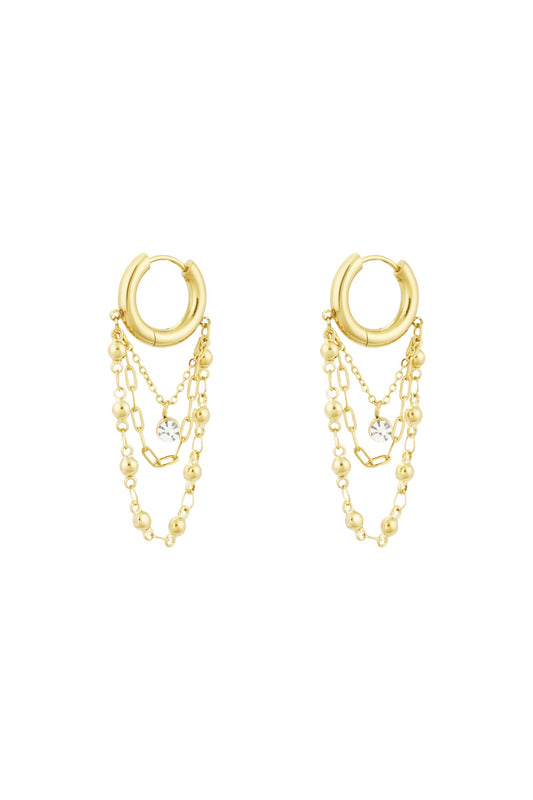 Gold chained hoop drop earrings with three delicate chains and rhinestone charm on white background