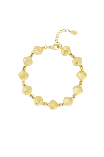 Close-up of gold plated seashell charm bracelet with adjustable chain clasp.