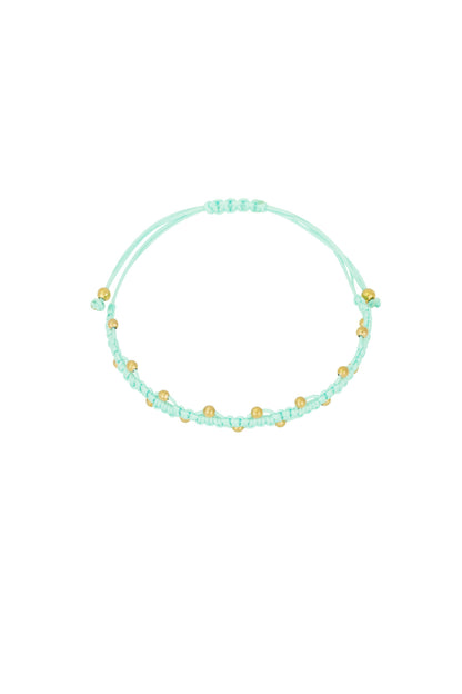 Close-up of mint braided bead bracelet on white background