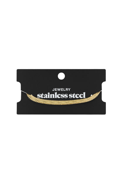 Gold snake chain bracelet displayed on black packaging card labeled stainless steel