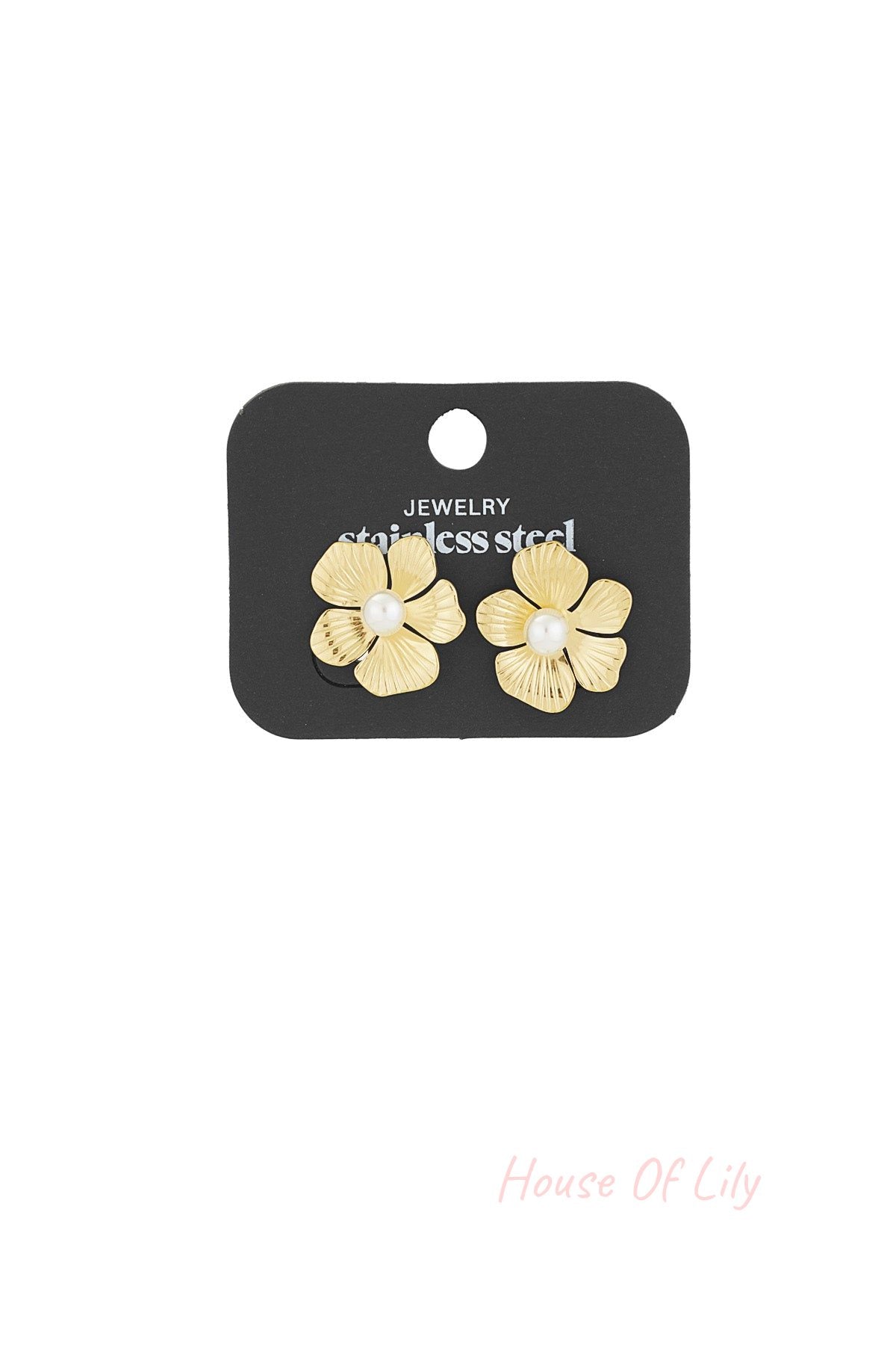 Pair of gold floral pearl stud earrings displayed on a black jewelry card labeled stainless steel