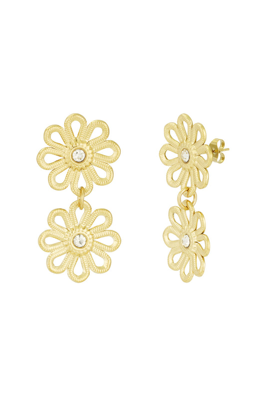 Pair of gold-tone double flower drop earrings with clear crystal centers displayed against a white background
