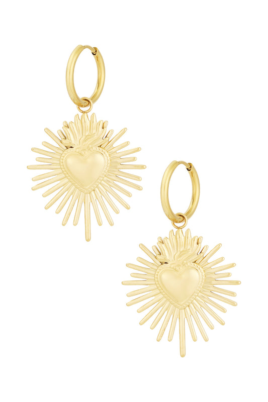 Gold-tone Milagros heart-shaped sunburst drop earrings on white background