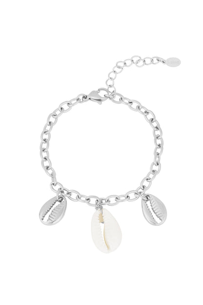 Silver-tone chain bracelet with three shell charms: two silver-tone and one natural white shell on white background