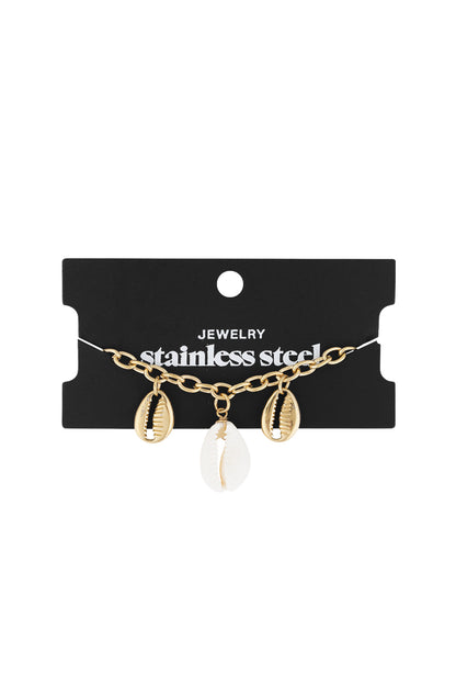 Gold-tone shell link bracelet displayed on black cardboard packaging labeled stainless steel jewellery