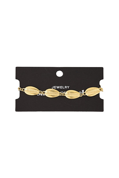 Gold shell charm bracelet displayed on a black jewellery card highlighting polished finish and shell details
