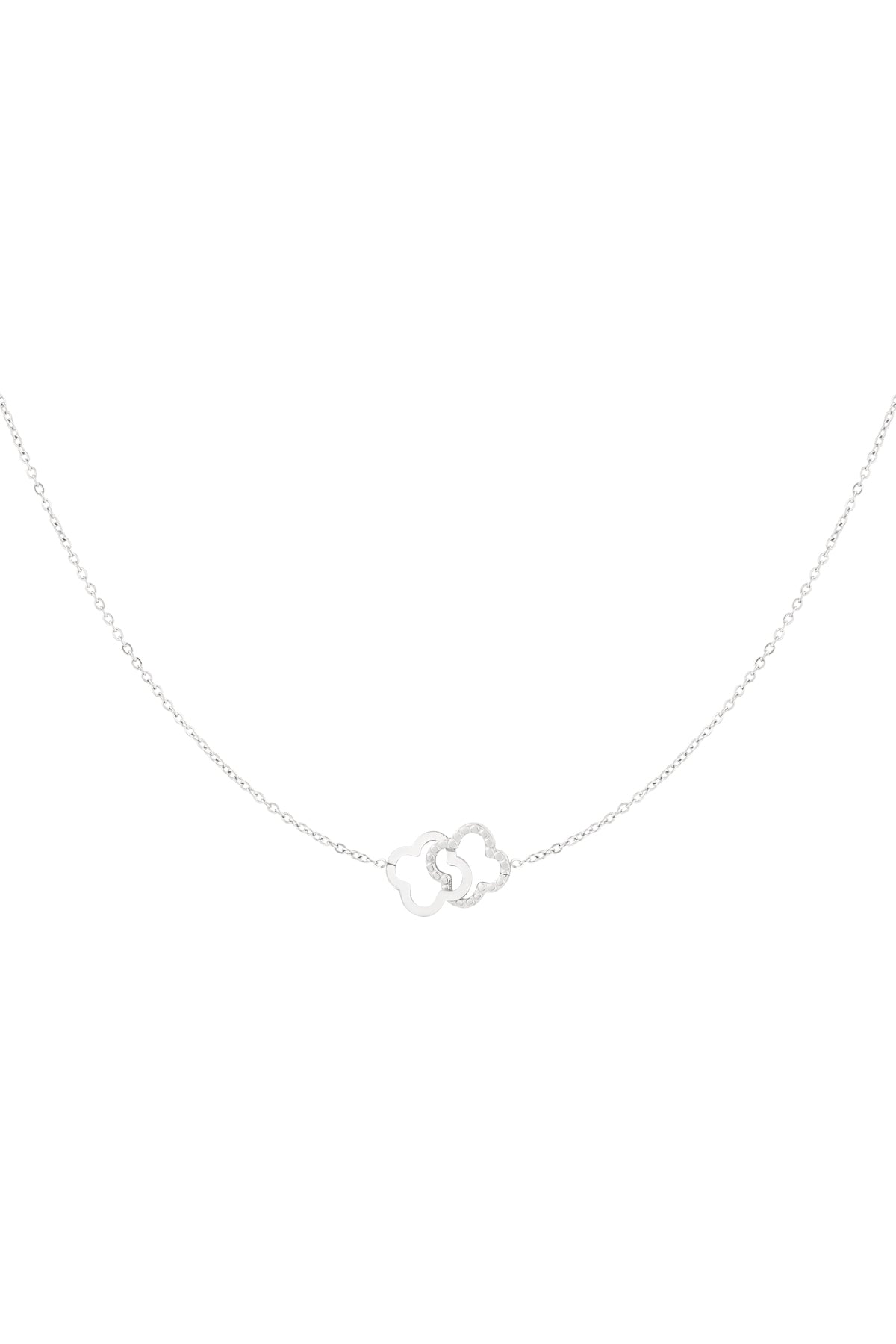 Silver interlinked clover pendant necklace on white background
