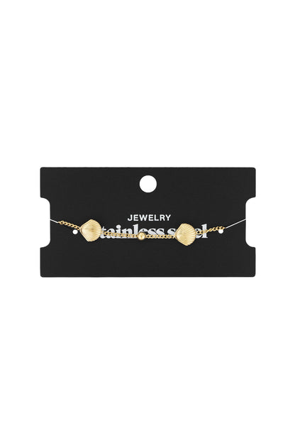 Silver seashell charm bracelet displayed on black card with 'Jewelry stainless steel' text