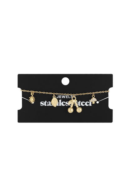 Gold charm bracelet displayed on black jewellery card labelled stainless steel