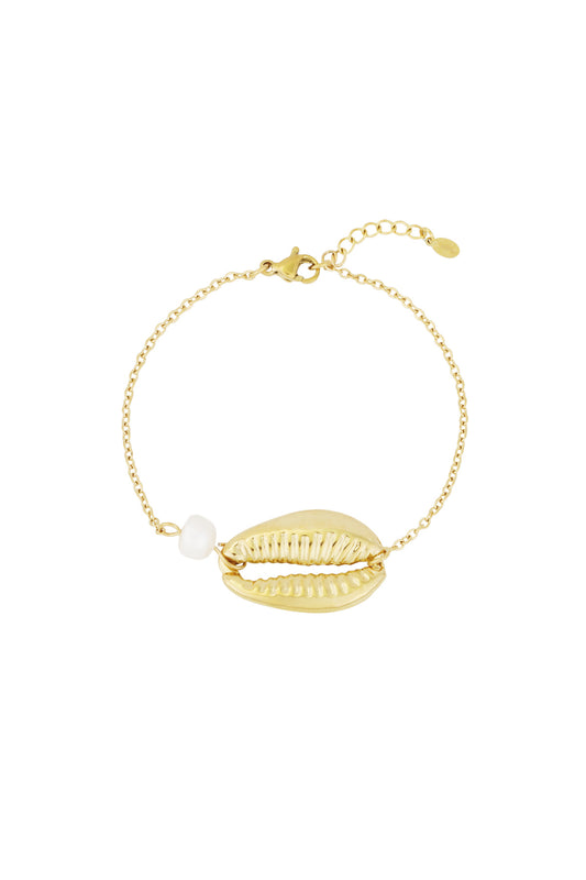 Gold-tone chain bracelet with a detailed shell charm and a single pearl bead on a white background