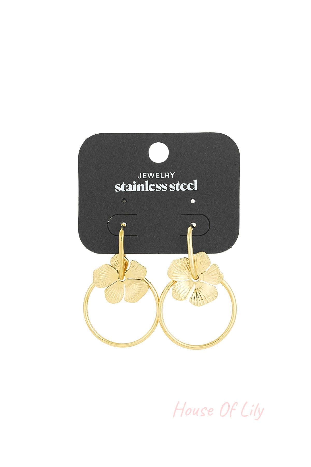Gold-tone floral hoop earrings displayed on black jewelry card labeled stainless steel