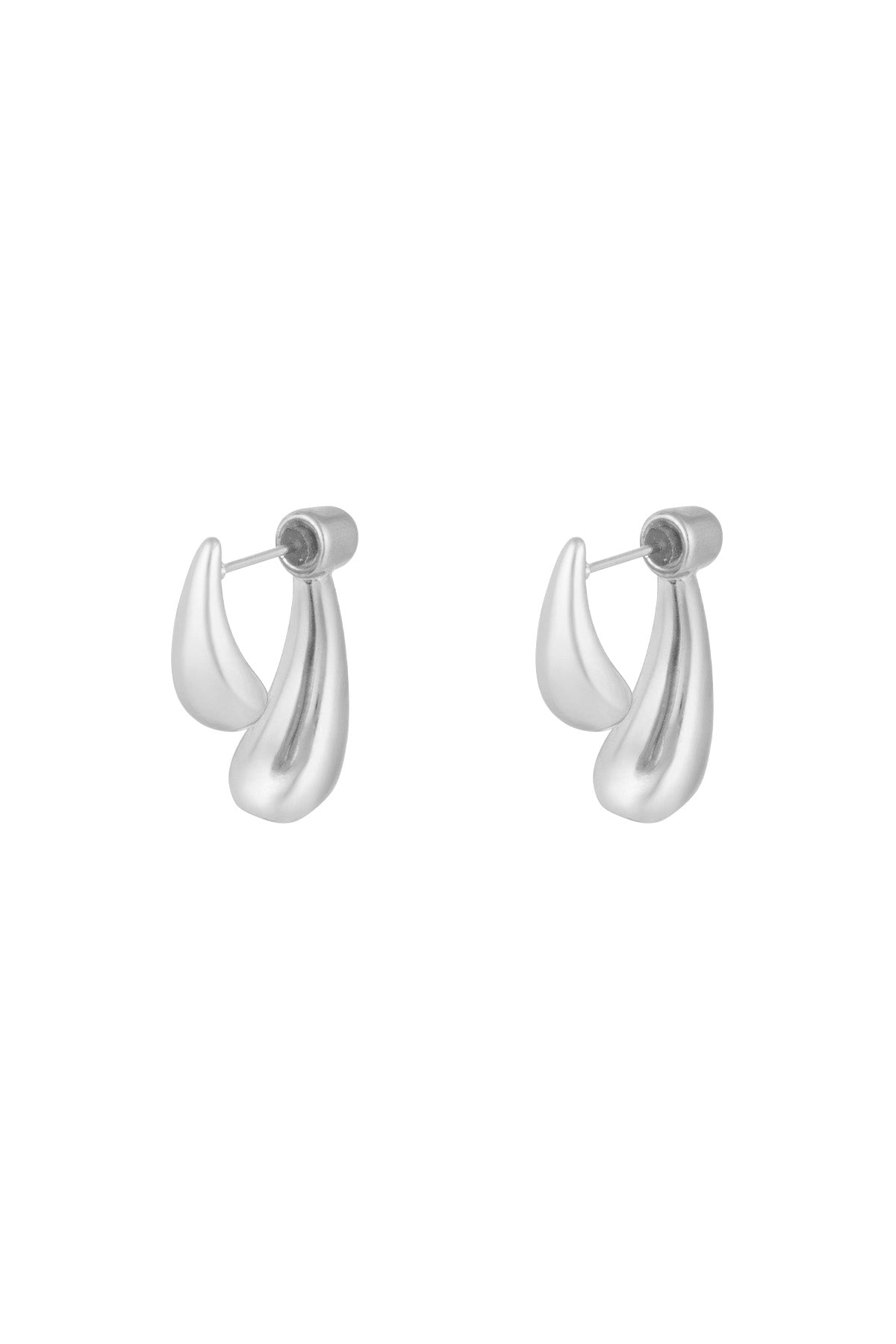 Silver sculptural stud earrings with abstract teardrop shapes on white background