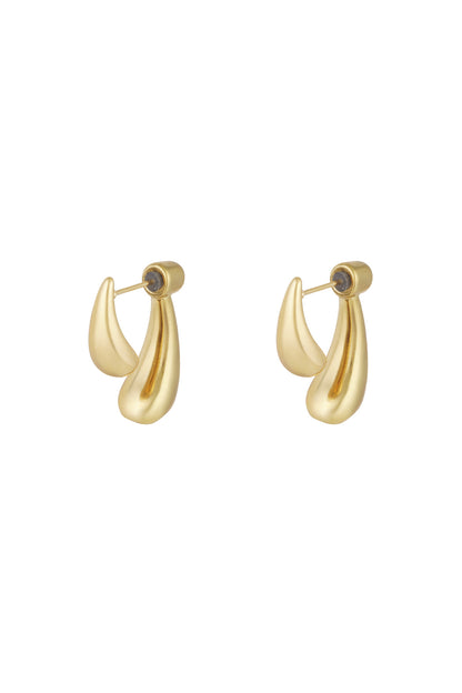 Gold sculptural stud earrings with abstract teardrop shapes on white background