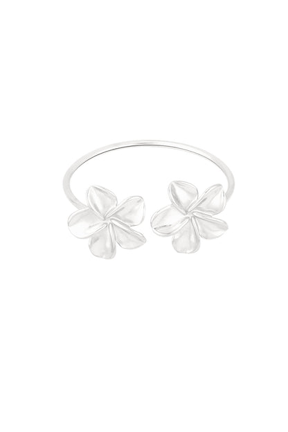 Silver-tone open cuff bracelet featuring two polished flower accents against white background