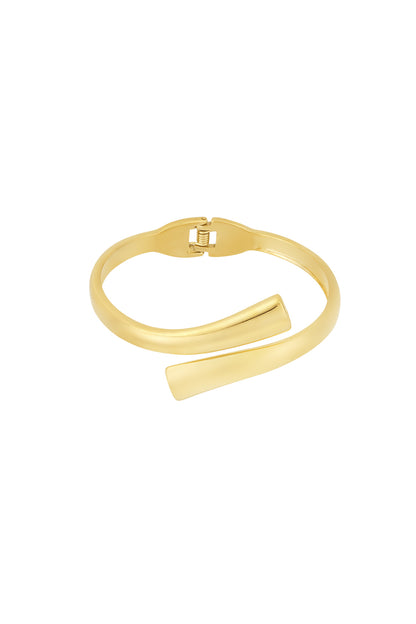 Gold spiral-shaped cuff bracelet with hinged clasp on white background