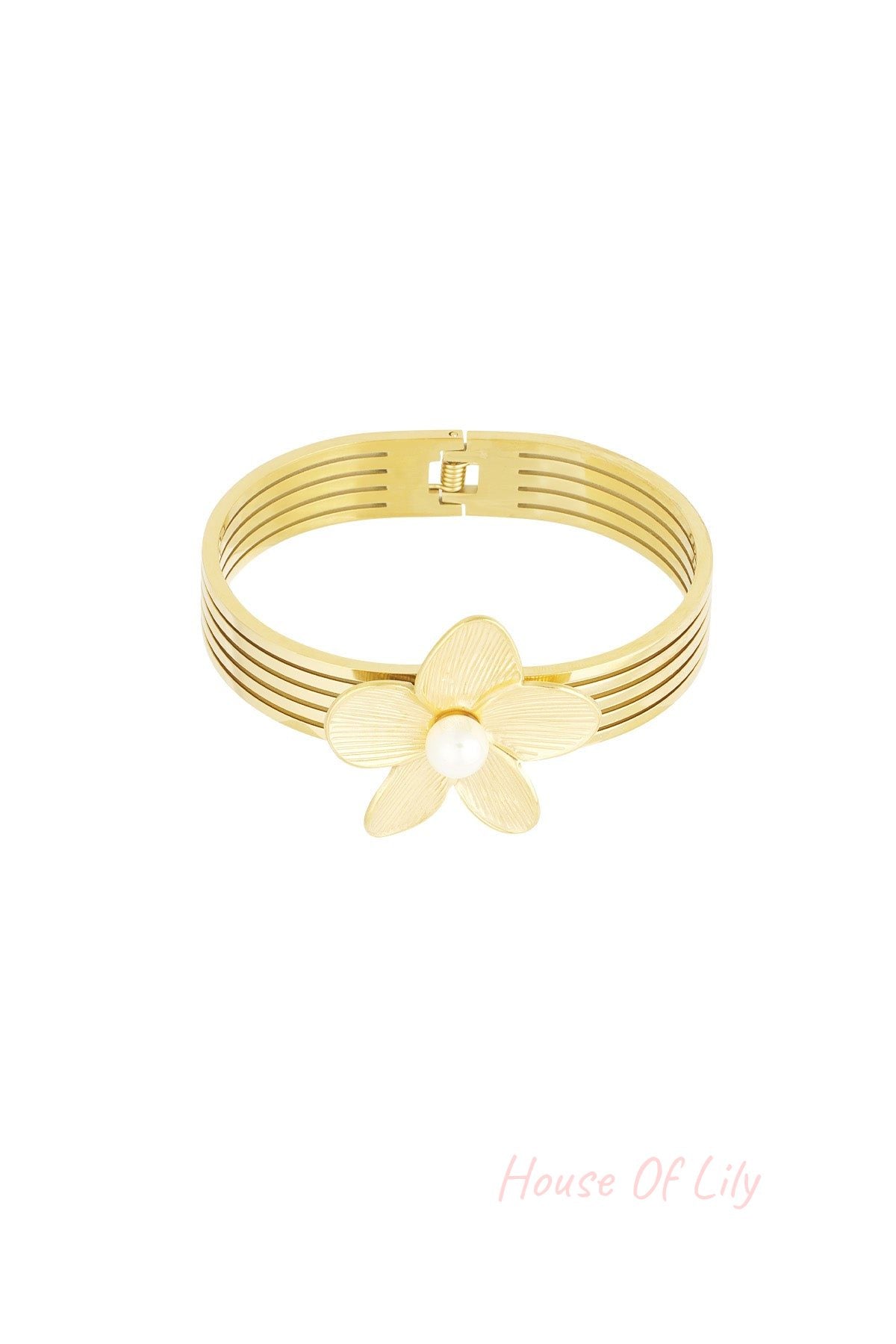 Close-up of a gold-tone multi-strand bangle bracelet featuring a textured flower and central pearl accent on a white background