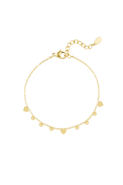Gold-tone stainless steel bracelet with small heart and bead charms on adjustable chain