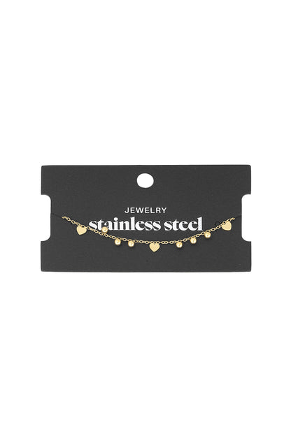 Heart charm bracelet displayed on a black card labelled stainless steel jewellery