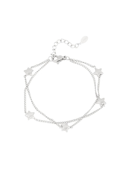 Silver-tone double chain bracelet featuring small star charms on white background