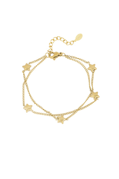 Gold-tone double chain bracelet adorned with small star charms on white background