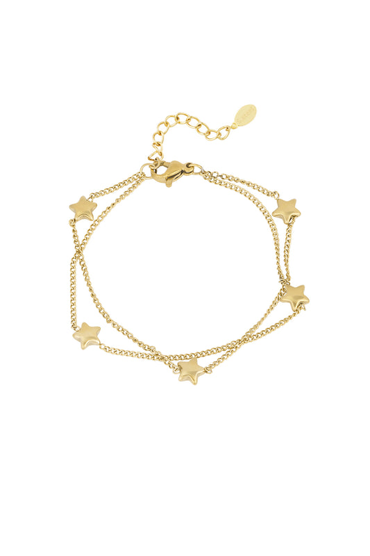 Gold-tone double chain bracelet adorned with small star charms on white background