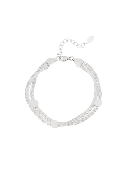 Silver-tone stainless steel flat chain bracelet with three round dot accents and adjustable clasp on white background