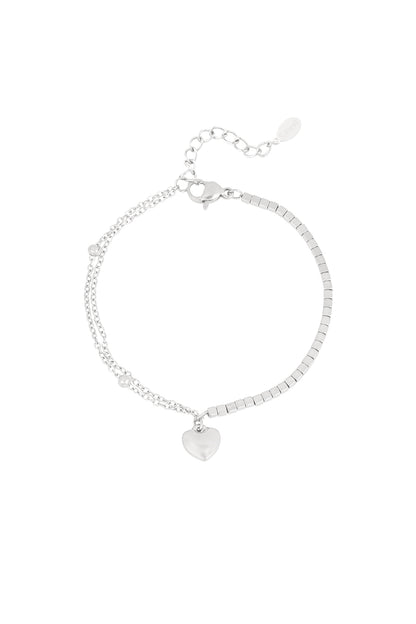Silver stainless steel heart charm bracelet with mixed chain and square beads design on white background