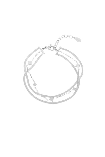 Silver-toned version of the multi-layered bracelet with star charms displayed on white background