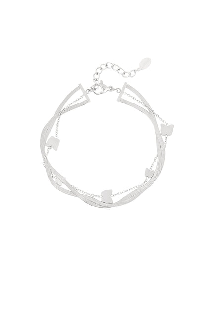 Silver version of the butterfly charm bracelet featuring layered delicate chains and butterfly charms, on white background