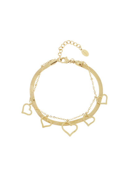 Gold heart charm bracelet with multiple heart-shaped pendants and herringbone chain on white background