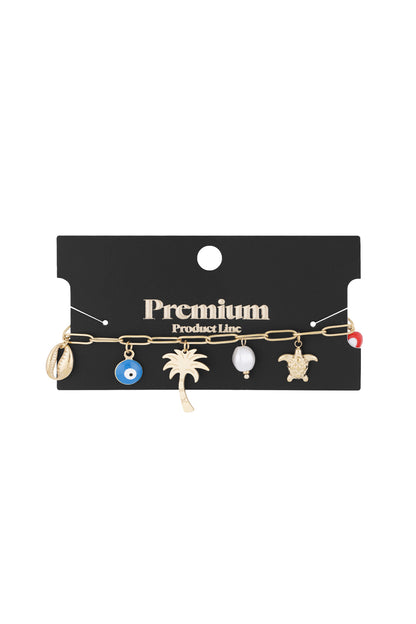 Gold-tone charm bracelet displayed on a black 'Premium Product Line' card showing all summer-themed charms.