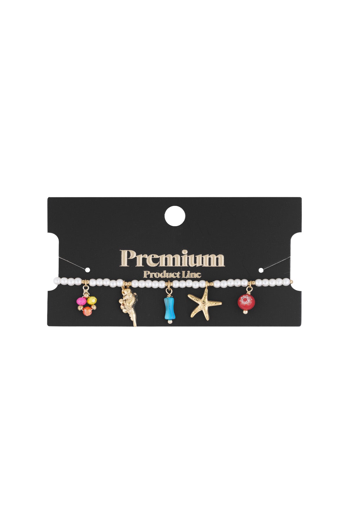 Pearl bracelet with gold ocean-themed charms displayed on premium black packaging card